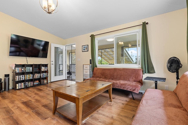 16-1580 39th Ave, Kurtistown, HI 96760 - living room with wood finished floors, vaulted ceiling, and a chandelier