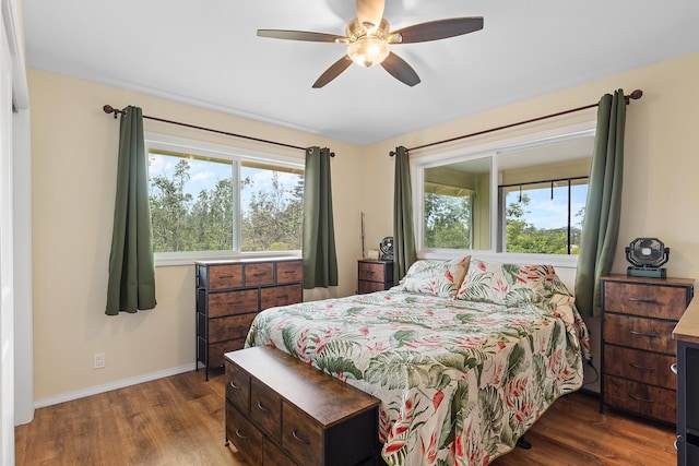 16-1580 39th Ave, Kurtistown, HI 96760 - bedroom featuring wood finished floors, multiple windows, and baseboards