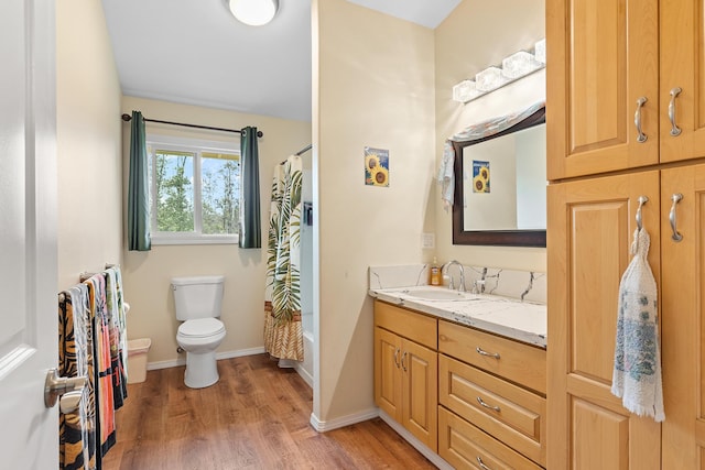 16-1580 39th Ave, Kurtistown, HI 96760 - bathroom with toilet, wood finished floors, vanity, shower / tub combo, and baseboards