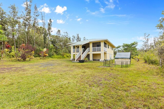 16-1580 39th Ave, Kurtistown, HI 96760 - back of house with stairs and a lawn