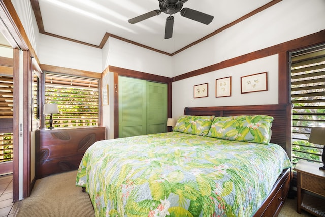 2253 Poipu Rd Unit 25, Koloa, HI 96756 - bedroom featuring multiple windows, ornamental molding, ceiling fan, and a closet