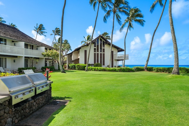 2253 Poipu Rd Unit 25, Koloa, HI 96756 - surrounding community with a water view and a lawn