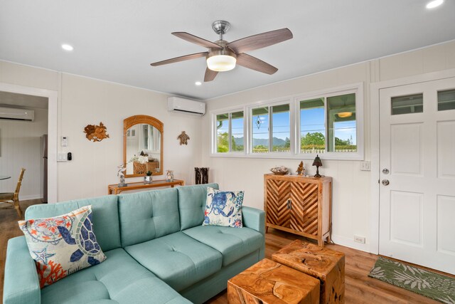 5587 Kawaihau Rd, Kapaa, HI 96746 - living area with a wall mounted AC, wood finished floors, ceiling fan, and recessed lighting