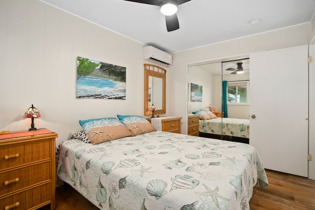 5587 Kawaihau Rd, Kapaa, HI 96746 - bedroom with wood finished floors, a wall unit AC, a closet, and a ceiling fan