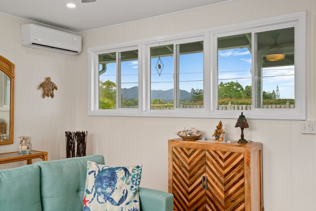 5587 Kawaihau Rd, Kapaa, HI 96746 - living area featuring a wall unit AC, a mountain view, and a decorative wall