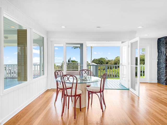 76-5807 Hookahi St Unit 1, Holualoa, HI 96725 - dining area featuring wood finished floors, crown molding, and a decorative wall