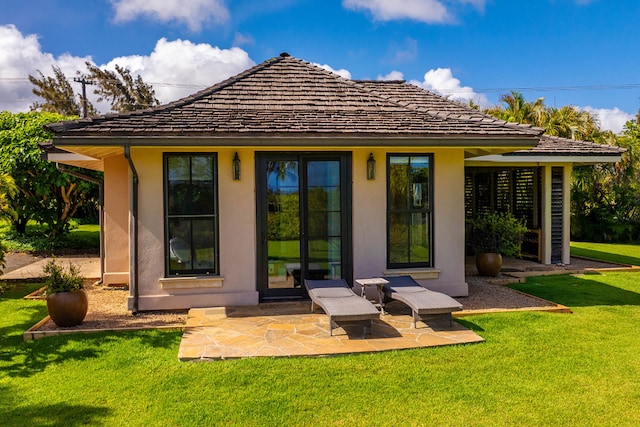 3661 Papalina Rd Unit A, Kalaheo, HI 96741 - rear view of house with a lawn, stucco siding, and a patio