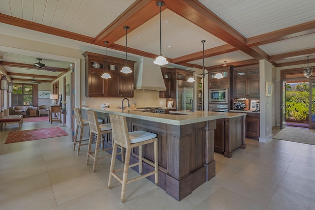3661 Papalina Rd Unit A, Kalaheo, HI 96741 - kitchen with built in appliances, premium range hood, decorative backsplash, light countertops, and a ceiling fan
