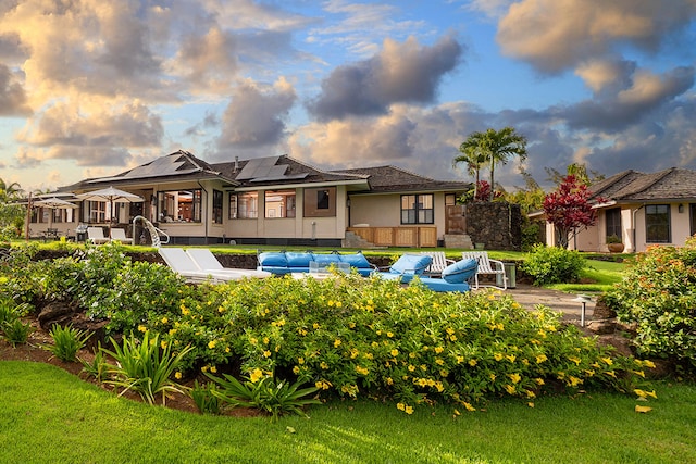 3661 Papalina Rd Unit A, Kalaheo, HI 96741 - back of house with stucco siding and solar panels
