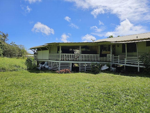15-1483 28th Ave, Keaau, HI 96749 - rear view of property with a lawn and metal roof