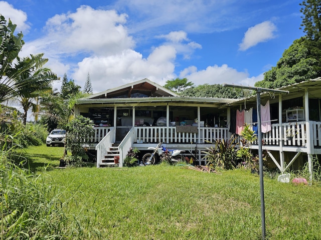 15-1483 28th Ave, Keaau, HI 96749 - view of front of home with a front yard and a porch