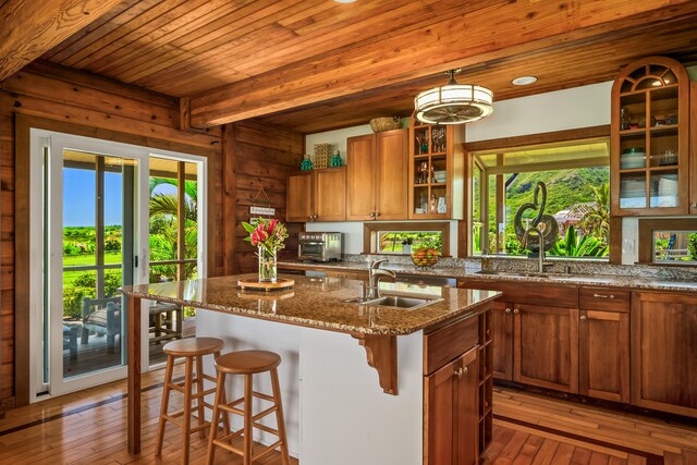 5421-C Kalalea View Dr, Anahola, HI 96703 - kitchen featuring a sink, wood-type flooring, brown cabinetry, and wooden ceiling with exposed beams