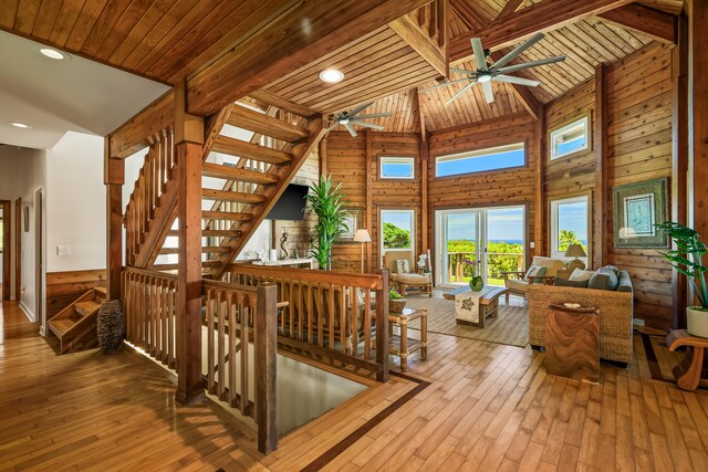 5421-C Kalalea View Dr, Anahola, HI 96703 - interior space with a ceiling fan, wood-type flooring, wooden walls, high vaulted ceiling, and wood ceiling with exposed beams
