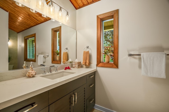5421-C Kalalea View Dr, Anahola, HI 96703 - bathroom with wooden ceiling, vanity, baseboards, and toilet