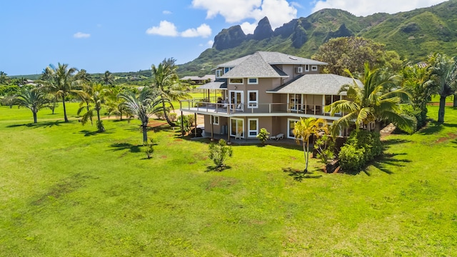 5421-C Kalalea View Dr, Anahola, HI 96703 - rear view of property with a deck with mountain view and a lawn
