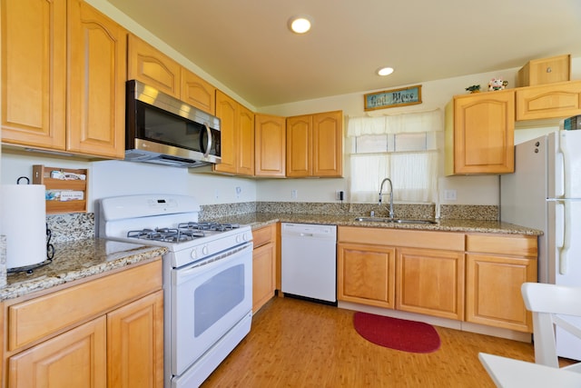 12-7042 Wehelauniu St, Pahoa, HI 96778 - kitchen with white appliances, a sink, light wood-style floors, recessed lighting, and light stone countertops