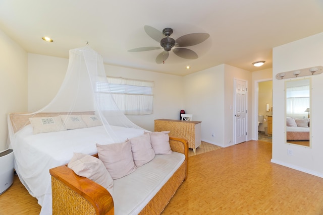 12-7042 Wehelauniu St, Pahoa, HI 96778 - bedroom with wood finished floors, a ceiling fan, and baseboards