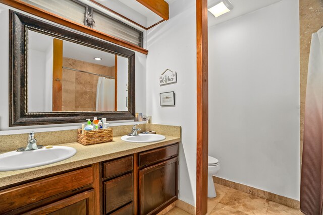 5366 Kumole St, Kapaa, HI 96746 - bathroom featuring double vanity, toilet, baseboards, tile patterned flooring, and a shower with shower curtain