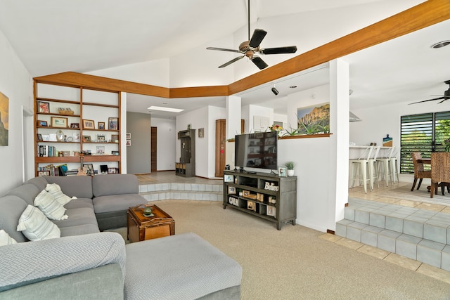 5366 Kumole St, Kapaa, HI 96746 - tiled living room with ceiling fan, carpet flooring, high vaulted ceiling, and baseboards