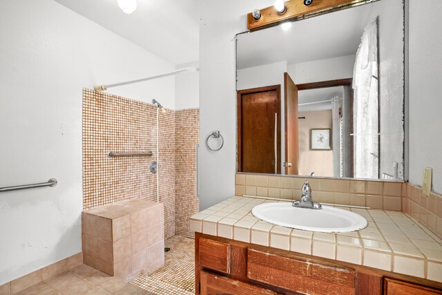 187 Lihau St, Kapaa, HI 96746 - full bath with a tile shower, vanity, and tile patterned flooring