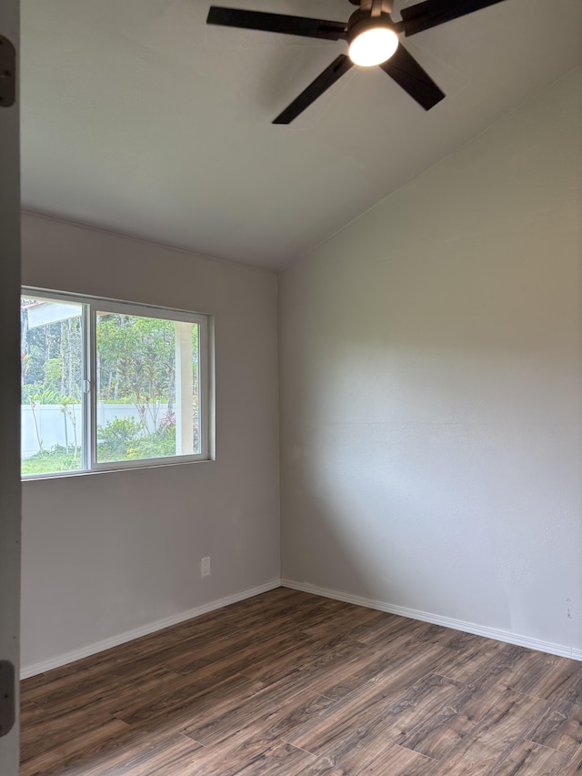 16-2157 Emerald Dr, Pahoa, HI 96778 - unfurnished room with dark wood-type flooring, lofted ceiling, and a ceiling fan