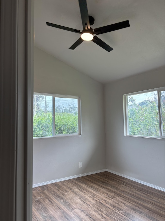 16-2157 Emerald Dr, Pahoa, HI 96778 - spare room with wood finished floors, vaulted ceiling, and a ceiling fan
