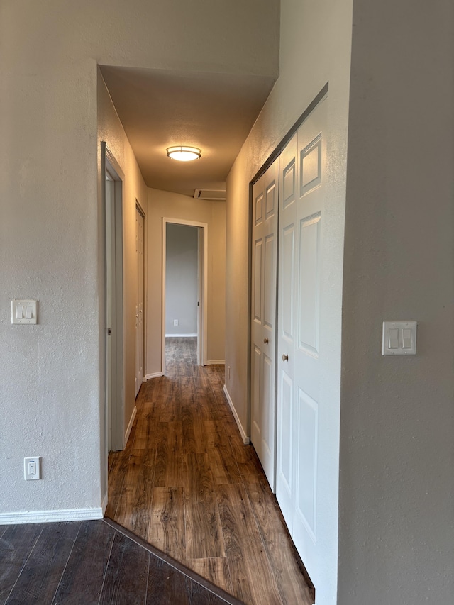 16-2157 Emerald Dr, Pahoa, HI 96778 - corridor with dark wood-style floors and a textured wall