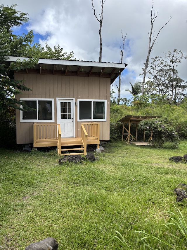 16-2157 Emerald Dr, Pahoa, HI 96778 - rear view of property with a deck and a lawn