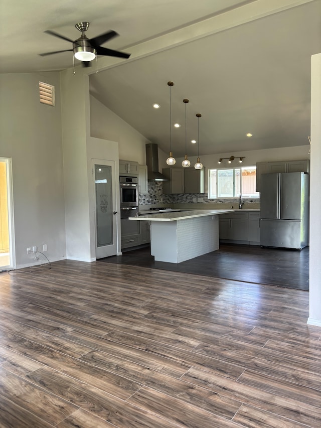 16-2157 Emerald Dr, Pahoa, HI 96778 - kitchen with stainless steel appliances, wall chimney range hood, open floor plan, decorative backsplash, and recessed lighting