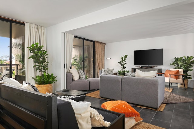 75-5865 Walua Rd Unit D624, Kailua-Kona, HI 96740 - living room featuring floor to ceiling windows and dark tile patterned flooring
