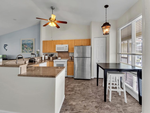 75-6009 Alii Dr Unit Y22, Kailua-Kona, HI 96740 - kitchen featuring white appliances, a peninsula, dark stone counters, pendant lighting, and ceiling fan