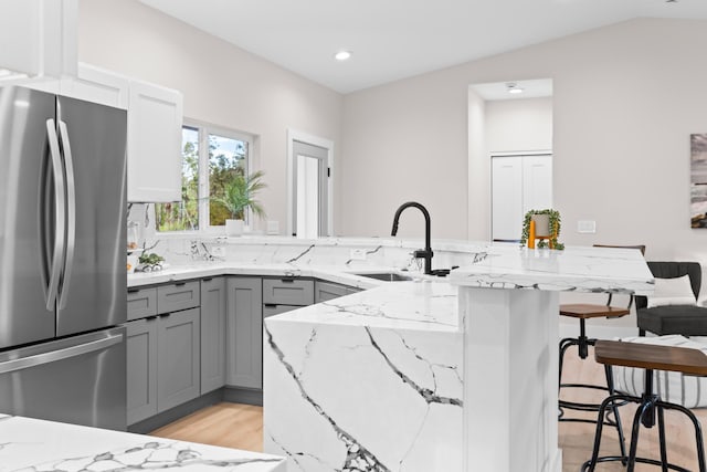 15-2026 20th Ave, Keaau, HI 96749 - kitchen featuring freestanding refrigerator, gray cabinetry, a sink, light stone counters, and recessed lighting