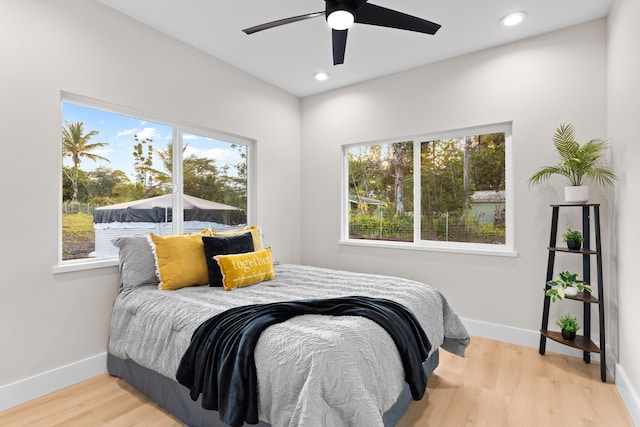 15-2026 20th Ave, Keaau, HI 96749 - bedroom featuring baseboards, multiple windows, wood finished floors, and recessed lighting