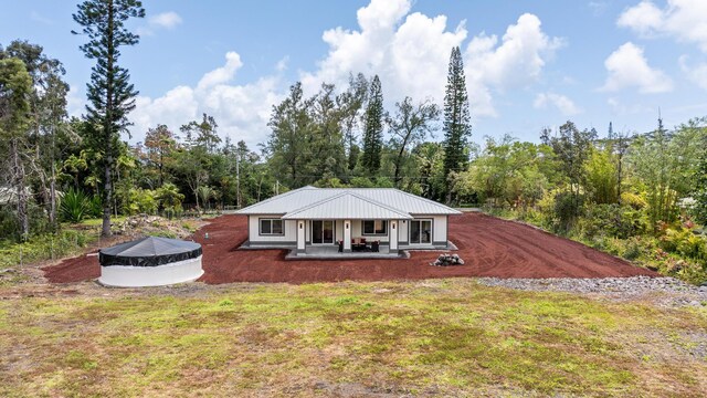 15-2026 20th Ave, Keaau, HI 96749 - view of front of property featuring a patio, a front yard, and a wooded view