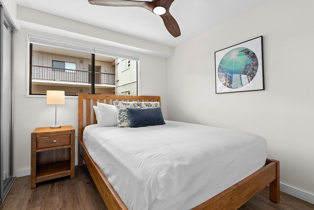 75-5719 Alii Dr Unit 307, Kailua-Kona, HI 96740 - bedroom with wood finished floors, baseboards, and ceiling fan