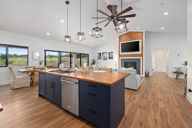 71-1871 Puu Lani Loop, Kailua-Kona, HI 96740 - kitchen featuring stainless steel dishwasher, wooden counters, a ceiling fan, an island with sink, and open floor plan