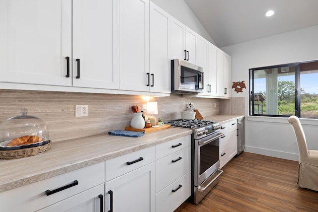 71-1871 Puu Lani Loop, Kailua-Kona, HI 96740 - kitchen featuring appliances with stainless steel finishes, tasteful backsplash, white cabinets, light countertops, and dark wood-style floors