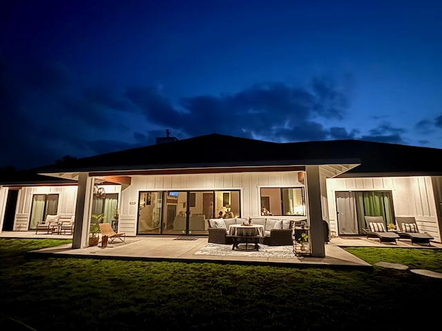 71-1871 Puu Lani Loop, Kailua-Kona, HI 96740 - back of house at twilight with an outdoor living space, a patio, and a yard