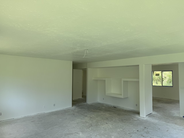 13-3436 Alapai St, Pahoa, HI 96778 - unfurnished room with a textured ceiling