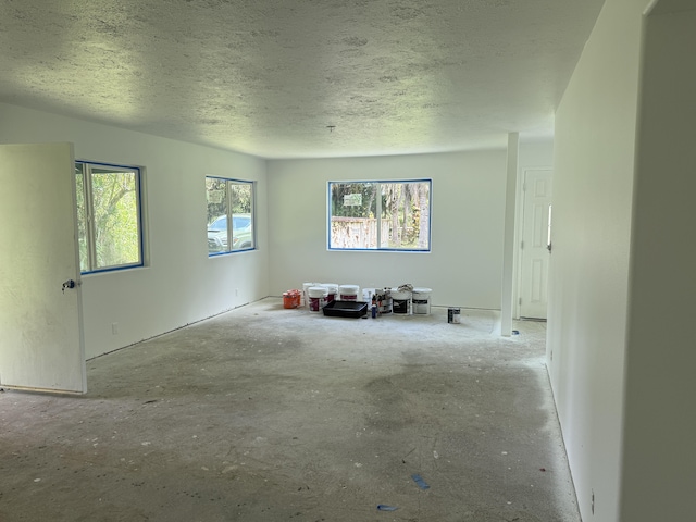 13-3436 Alapai St, Pahoa, HI 96778 - unfurnished living room featuring a textured ceiling