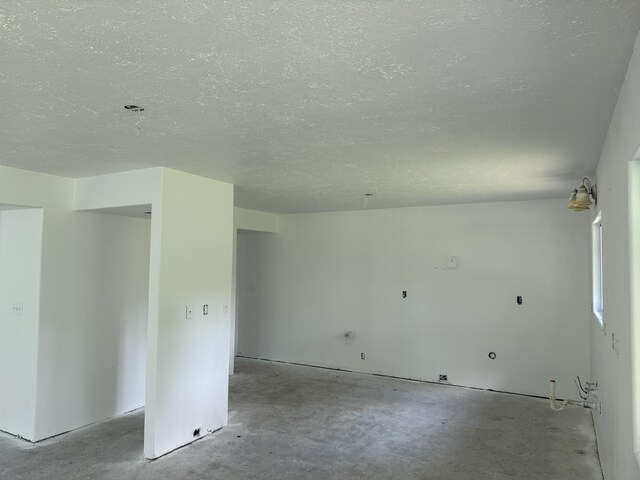 13-3436 Alapai St, Pahoa, HI 96778 - spare room featuring a textured ceiling and unfinished concrete floors