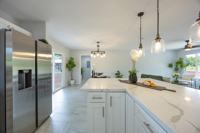 15-1791 4th Ave, Keaau, HI 96749 - kitchen with stainless steel fridge, white cabinetry, pendant lighting, light stone countertops, and a chandelier