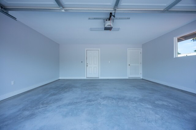 15-1791 4th Ave, Keaau, HI 96749 - garage featuring a garage door opener and baseboards