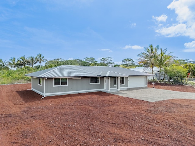 15-1791 4th Ave, Keaau, HI 96749 - single story home featuring metal roof, dirt driveway, a garage, and covered porch