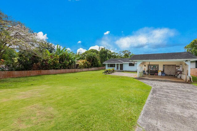 171 Lani Alii Pl, Kapaa, HI 96746 - view of yard featuring asphalt driveway