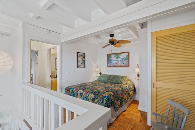 2321 Hoohu Rd, Koloa, HI 96756 - bedroom featuring beamed ceiling, a closet, and a ceiling fan