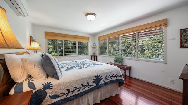 5-6691 Kuhio Hwy, Hanalei, HI 96714 - bedroom with a wall mounted AC, hardwood / wood-style flooring, and baseboards
