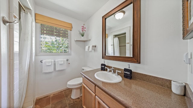 5-6691 Kuhio Hwy, Hanalei, HI 96714 - full bath featuring vanity, toilet, stone finish floors, and a shower with curtain