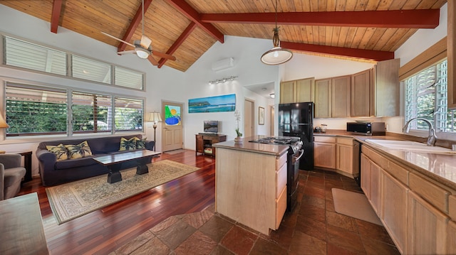 5-6691 Kuhio Hwy, Hanalei, HI 96714 - kitchen with open floor plan, gas stove, stainless steel microwave, a sink, and a center island