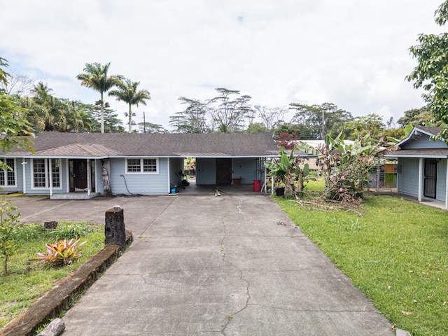 15-2755 Akule St, Pahoa, HI 96778 - ranch-style home with driveway, a front yard, and an attached carport